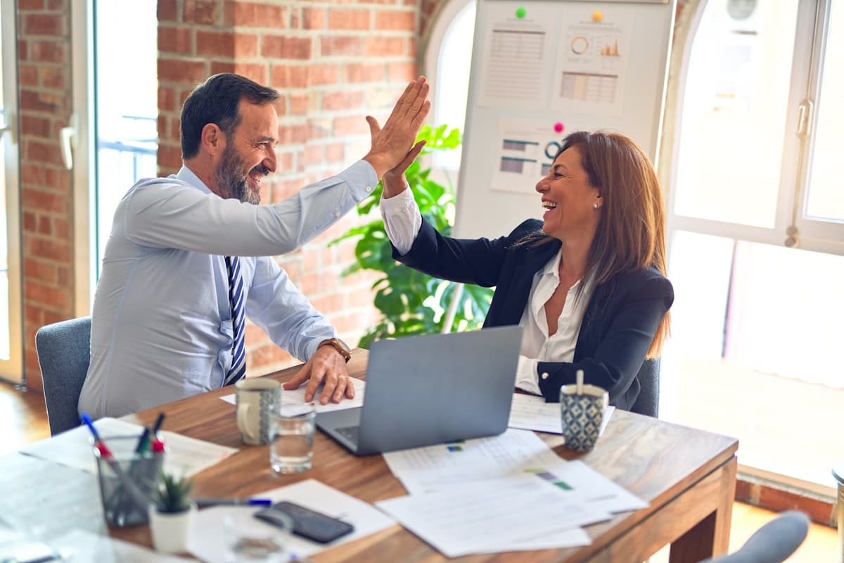 A Mossco Realty client celebrating a successful, well-guided real estate investment